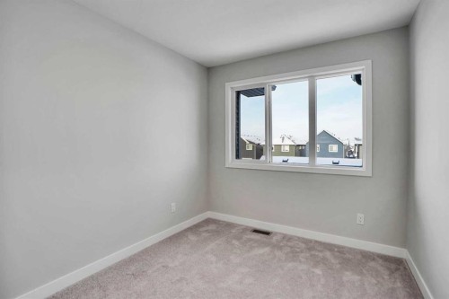 144 Cobblestone Gate Sw, Airdrie, AB - Indoor Photo Showing Other Room