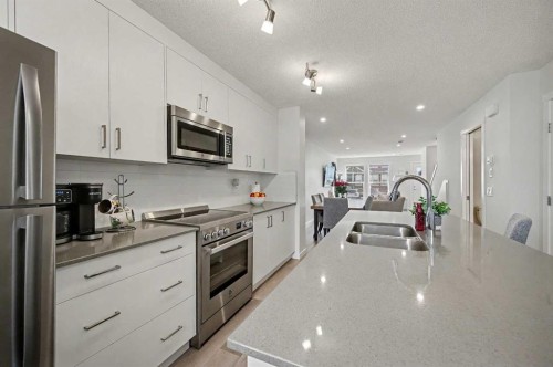 352 Cranbrook Square Se, Calgary, AB - Indoor Photo Showing Kitchen With Stainless Steel Kitchen With Double Sink With Upgraded Kitchen