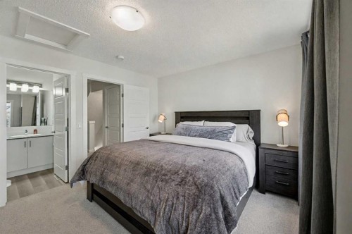 352 Cranbrook Square Se, Calgary, AB - Indoor Photo Showing Bedroom