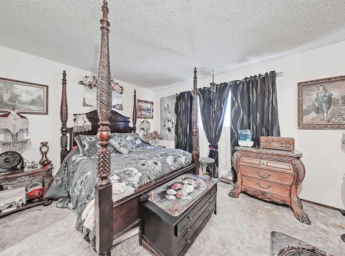32 Sheppard Road Sw, High River, AB - Indoor Photo Showing Bedroom