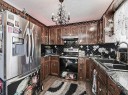 32 Sheppard Road Sw, High River, AB  - Indoor Photo Showing Kitchen With Double Sink 