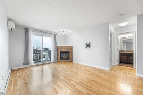 4313-31 Country Village Manor Ne, Calgary, AB - Indoor Photo Showing Living Room With Fireplace