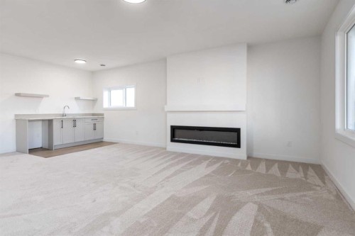 208 Monterey Bay Se, High River, AB - Indoor Photo Showing Living Room With Fireplace