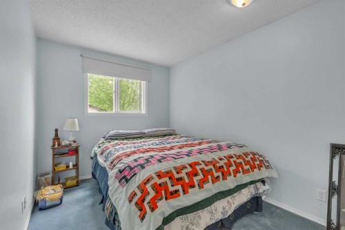 218 Pinemeadow Road Ne, Calgary, AB - Indoor Photo Showing Bedroom