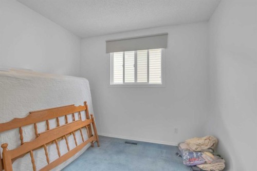 218 Pinemeadow Road Ne, Calgary, AB - Indoor Photo Showing Bedroom