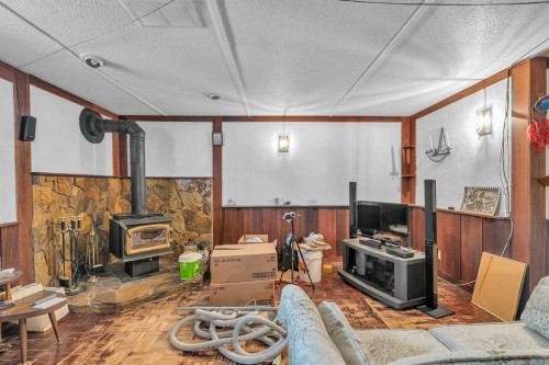 218 Pinemeadow Road Ne, Calgary, AB - Indoor Photo Showing Other Room With Fireplace