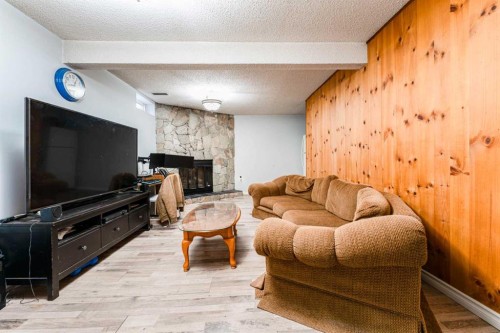 119 Falton Way Ne, Calgary, AB - Indoor Photo Showing Living Room With Fireplace