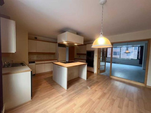 202A-500 Eau Claire Avenue Sw, Calgary, AB - Indoor Photo Showing Kitchen With Double Sink