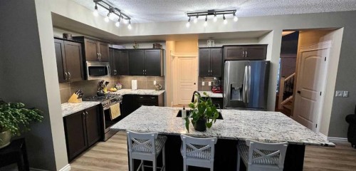 2117 Reunion Boulevard Nw, Airdrie, AB - Indoor Photo Showing Kitchen With Stainless Steel Kitchen With Upgraded Kitchen