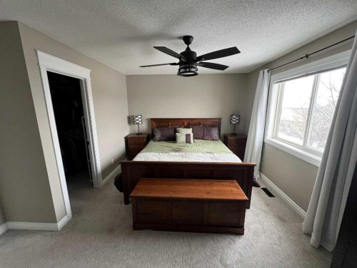 2117 Reunion Boulevard Nw, Airdrie, AB - Indoor Photo Showing Bedroom