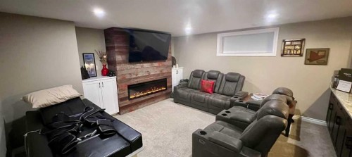 2117 Reunion Boulevard Nw, Airdrie, AB - Indoor With Fireplace
