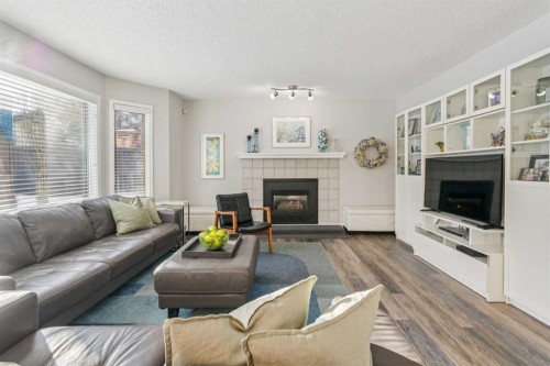 5945 Signal Ridge Heights Sw, Calgary, AB - Indoor Photo Showing Living Room With Fireplace