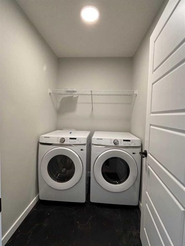 342 Baywater Common Sw, Airdrie, AB - Indoor Photo Showing Laundry Room