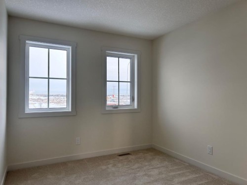 25 Sora Gate Se, Calgary, AB - Indoor Photo Showing Other Room