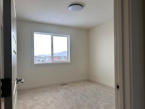 25 Sora Gate Se, Calgary, AB - Indoor Photo Showing Other Room