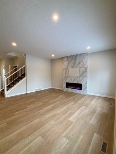 2762 Baywater Landing, Airdrie, AB - Indoor With Fireplace