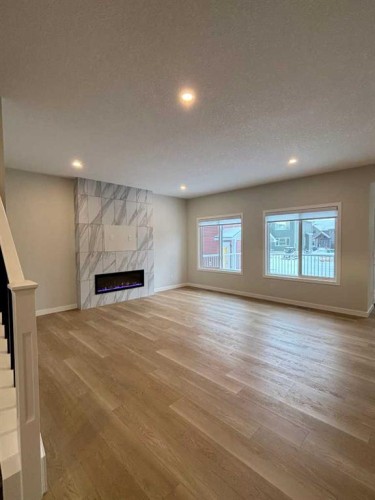 2762 Baywater Landing, Airdrie, AB - Indoor With Fireplace