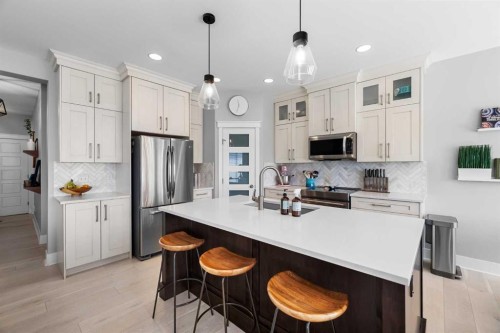 13 Royal Birch Park Nw, Calgary, AB - Indoor Photo Showing Kitchen With Stainless Steel Kitchen With Double Sink With Upgraded Kitchen