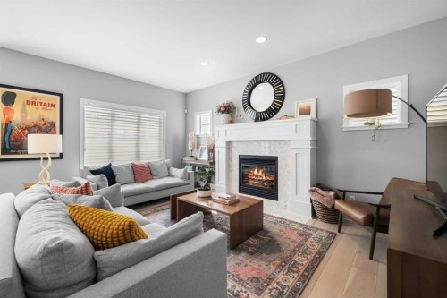 13 Royal Birch Park Nw, Calgary, AB - Indoor Photo Showing Living Room With Fireplace