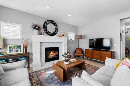 13 Royal Birch Park Nw, Calgary, AB - Indoor Photo Showing Living Room With Fireplace