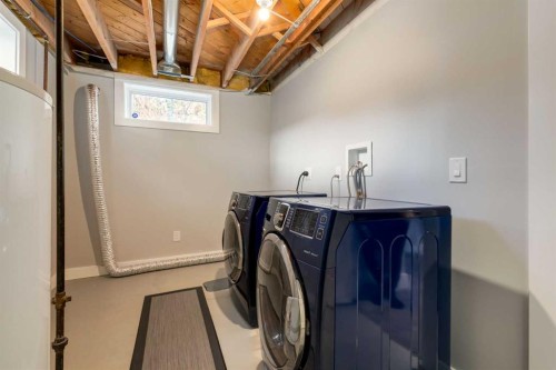 32 Calandar Road Nw, Calgary, AB - Indoor Photo Showing Laundry Room