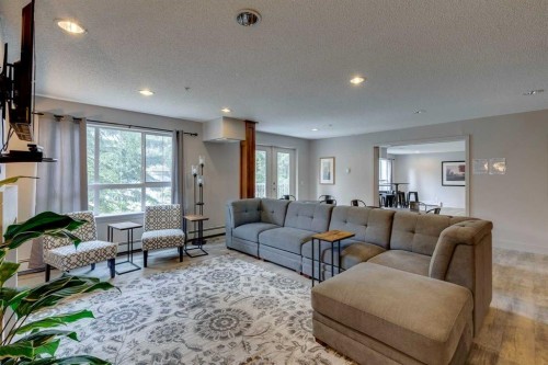 106-35 Richard Court Sw, Calgary, AB - Indoor Photo Showing Living Room