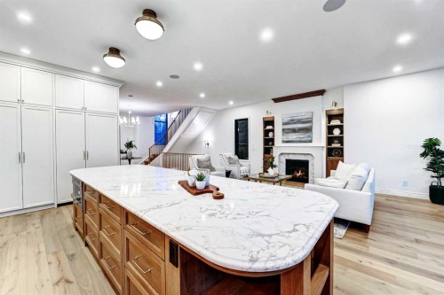 1936 31 Avenue Sw, Calgary, AB - Indoor Photo Showing Kitchen With Fireplace