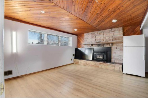 5501 58 Street, Olds, AB - Indoor Photo Showing Living Room With Fireplace