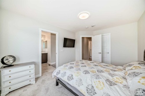 934 Cobblemore Common Sw, Airdrie, AB - Indoor Photo Showing Bedroom