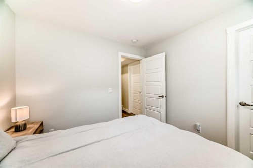 934 Cobblemore Common Sw, Airdrie, AB - Indoor Photo Showing Bedroom