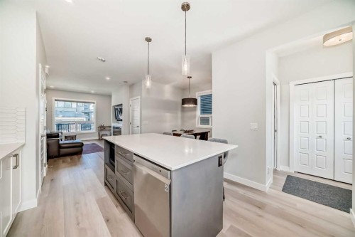 934 Cobblemore Common Sw, Airdrie, AB - Indoor Photo Showing Kitchen With Upgraded Kitchen