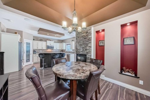 97 Auburn Glen Drive Se, Calgary, AB - Indoor Photo Showing Dining Room With Fireplace