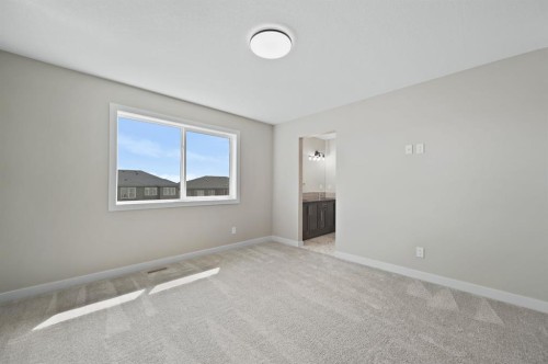 21 Sora Gate Se, Calgary, AB - Indoor Photo Showing Other Room