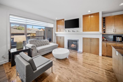 528 31 Street Nw, Calgary, AB - Indoor Photo Showing Living Room With Fireplace