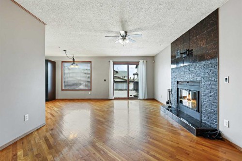 128 Ventura Way Ne, Calgary, AB - Indoor Photo Showing Other Room With Fireplace