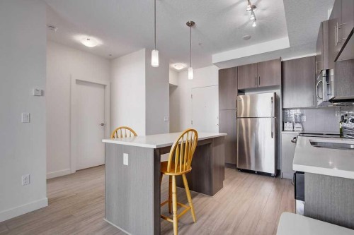 305-15233 1 Street Se, Calgary, AB - Indoor Photo Showing Kitchen With Upgraded Kitchen