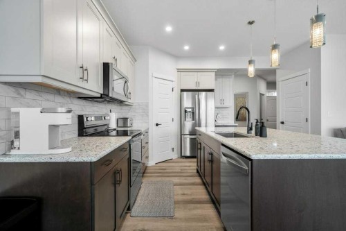 102 Creekside Way Sw, Calgary, AB - Indoor Photo Showing Kitchen With Stainless Steel Kitchen With Upgraded Kitchen
