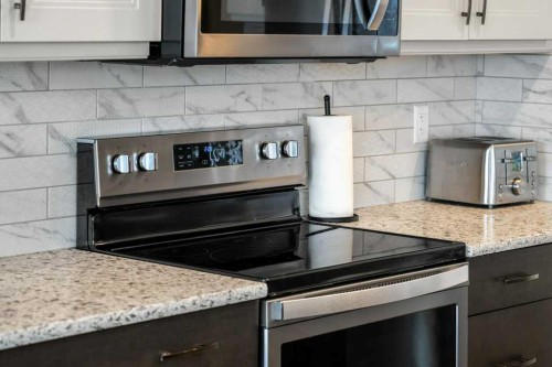 102 Creekside Way Sw, Calgary, AB - Indoor Photo Showing Kitchen With Upgraded Kitchen