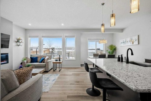 102 Creekside Way Sw, Calgary, AB - Indoor Photo Showing Living Room With Fireplace