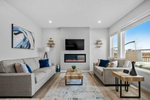 102 Creekside Way Sw, Calgary, AB - Indoor Photo Showing Living Room With Fireplace