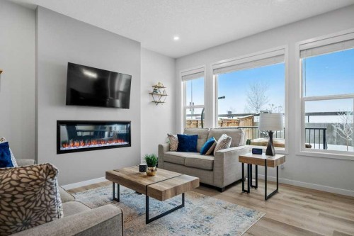 102 Creekside Way Sw, Calgary, AB - Indoor Photo Showing Living Room With Fireplace