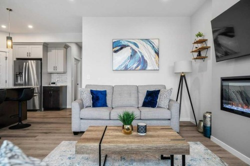 102 Creekside Way Sw, Calgary, AB - Indoor Photo Showing Living Room