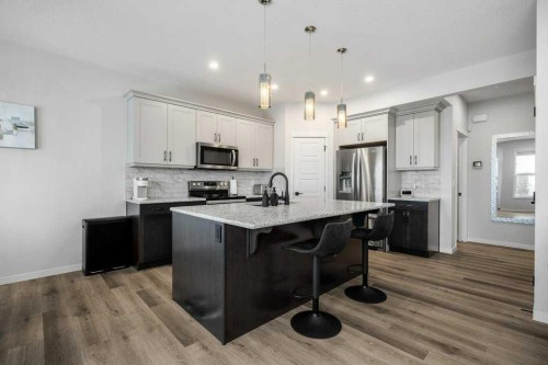 102 Creekside Way Sw, Calgary, AB - Indoor Photo Showing Kitchen With Stainless Steel Kitchen With Upgraded Kitchen