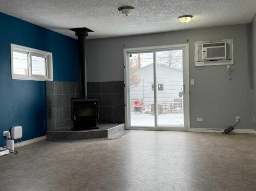 223 2 Street North, Vulcan, AB - Indoor With Fireplace