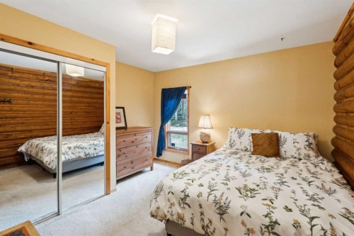 67 Bracken Point, Bragg Creek, AB - Indoor Photo Showing Bedroom