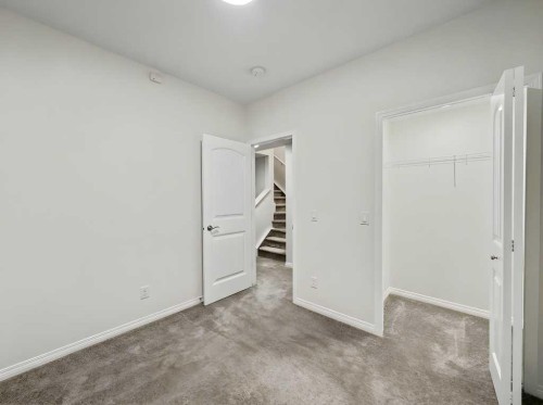 104 Masters Link Se, Calgary, AB - Indoor Photo Showing Other Room