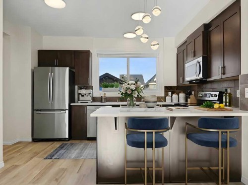 104 Masters Link Se, Calgary, AB - Indoor Photo Showing Kitchen With Stainless Steel Kitchen