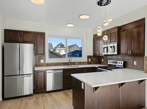 104 Masters Link Se, Calgary, AB - Indoor Photo Showing Kitchen With Stainless Steel Kitchen With Upgraded Kitchen