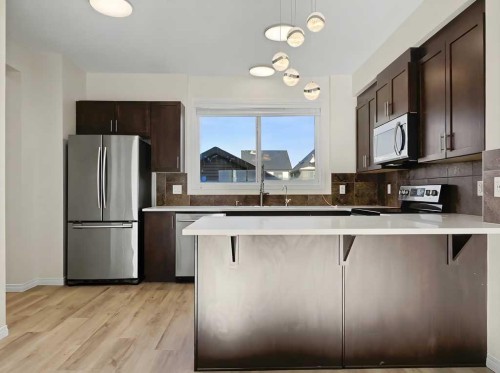 104 Masters Link Se, Calgary, AB - Indoor Photo Showing Kitchen With Stainless Steel Kitchen