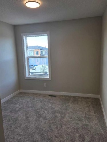 245 Cobblestone Gate Sw, Airdrie, AB - Indoor Photo Showing Other Room